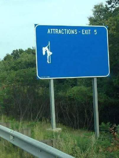 Highway Exit sign shows that the only attraction at this exit is an icon of a woman holding a pole.