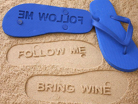 picture of thongs in the sand that stamped out, Follow Me, Bring Wine.