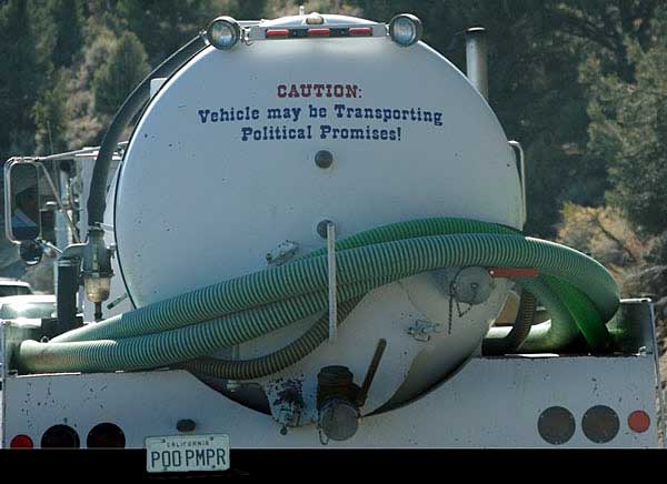 Sanitary Truck contains "Political Promises"