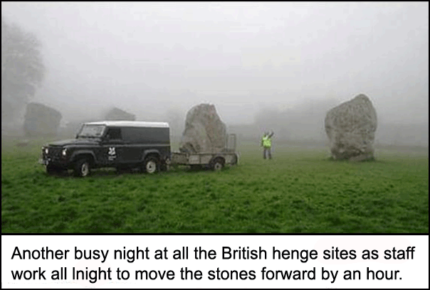 Funny photo of fake henge rocks being shifted around by the British - moving the stones forward by an hour.