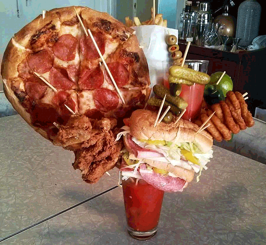 Bloody Mary has a pizza on a stick, a delicious sandwich, onion rings, all kinds of food on sticks coming out of one drink. Really well done photo and funny