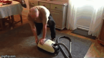 Man tries to pull vacuum cord as if it were a power cord.
