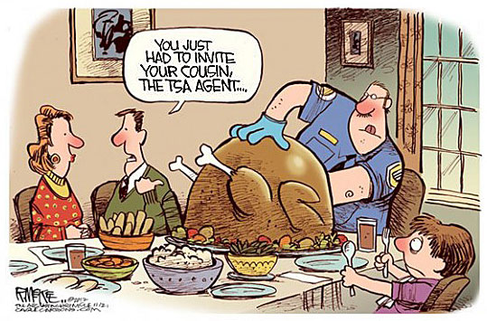 At the holiday table, a counsin who works with the TSA has on gloves and is checking the turkey's cavity.